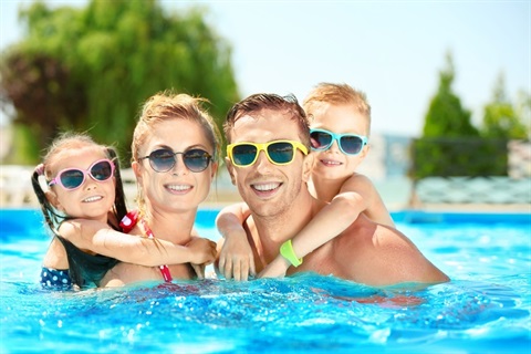 A-family-having-fun-at-a-swimming-pool.jpg